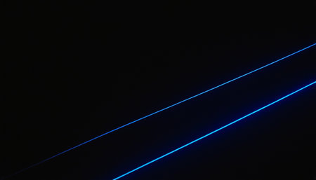 Blue and white neon lines on a black background. Long exposure photo.の素材