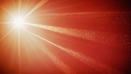 sunbeams and lens flare on red background. abstract background.の素材