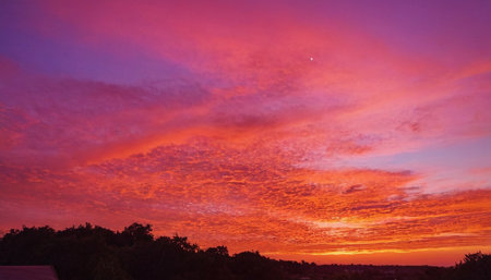 Colorful sunset with clouds in the sky. Beautiful natural background.の素材