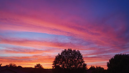 Colorful sunset with clouds in the sky over the countryside. Landscape.の素材