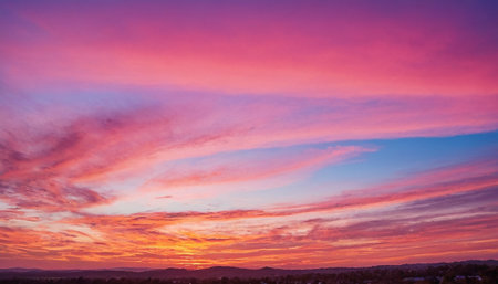 Colorful sunset in the sky with clouds over the city. Nature backgroundの素材