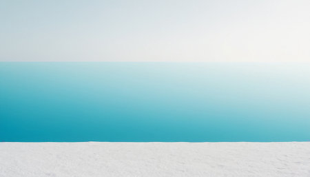 beautiful winter landscape with snow and turquoise sea on a sunny dayの素材