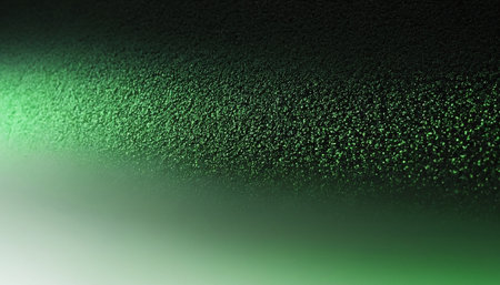 Green abstract background with light spots and bokeh. Texture.の素材