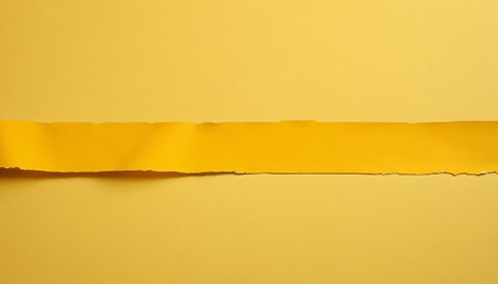 Torn yellow paper with space for your message or text on itの素材