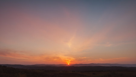 Sunset over the mountains in the evening. Landscape with sunsetの素材