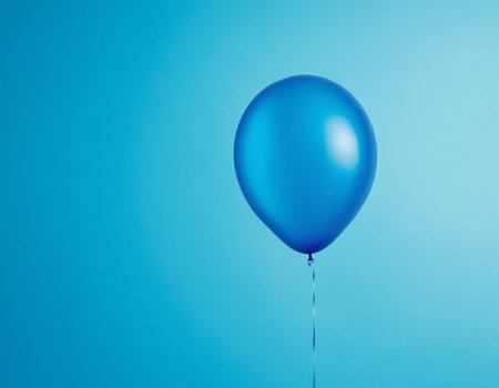 Blue balloon on a blue background with copy space for your text.の素材
