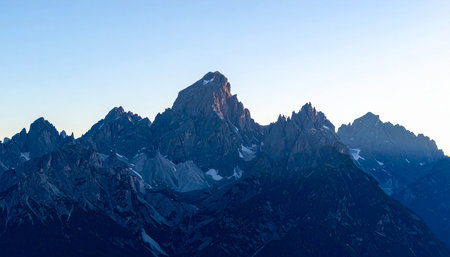 Mountain landscape. Snowy peaks of the Caucasus Mountains at sunset.の素材