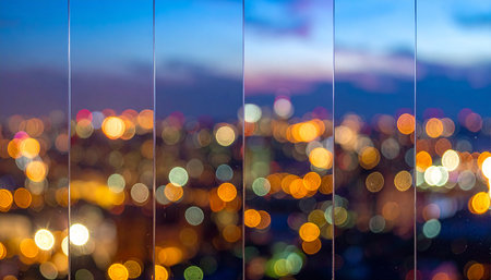 Blurred city lights bokeh at twilight time, abstract backgroundの素材