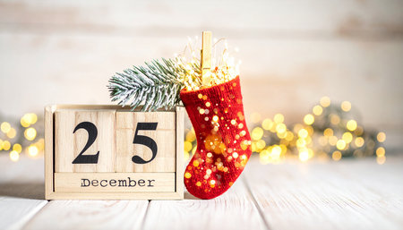 Christmas decoration with wooden cube calendar 25 december on bokeh backgroundの素材