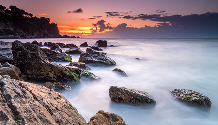 Long exposure of beautiful sunset at the beach in Bali, Indonesiaの素材