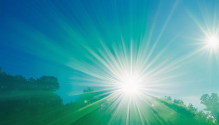 Sunset over the lake with sunbeams and lens flare.の素材