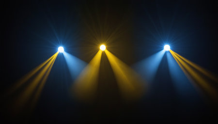 Stage lights on a black background. The stage is illuminated by spotlights.の素材