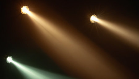 stage lighting effect on a black background with rays of light and smokeの素材