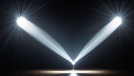 Spotlights illuminate the stage. Rays of light in the dark.の素材