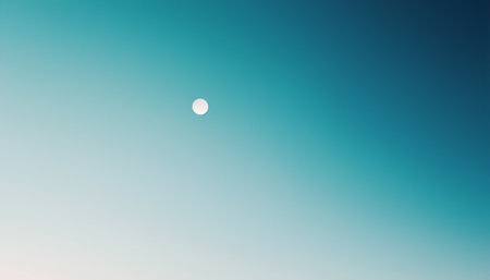 Moon in the blue sky. Blue sky background with a tiny clouds.の素材