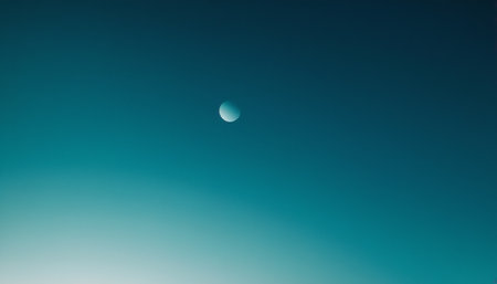 The moon in the blue sky. The moon is on the horizon.の素材