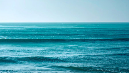 Beautiful sea waves in the blue sky. Natural background. Texture.の素材