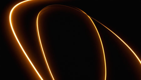 Abstract light trails on a black background. Curved lines in motion.の素材