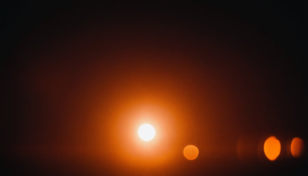 abstract bokeh background of the sun in the dark.の素材