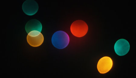 Colorful bokeh lights on black background. Abstract background.の素材