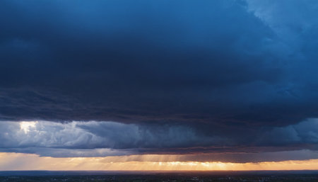 Dramatic stormy sky with rain clouds. Panorama.の素材