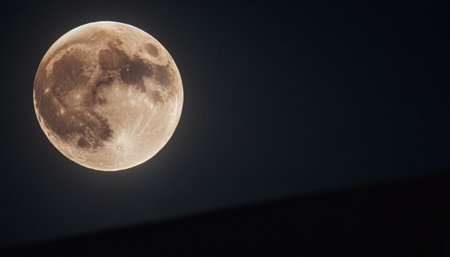 Full moon in the dark night sky. Space for your text.の素材