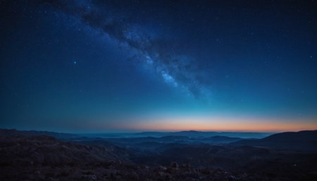 Milky way over the mountains at night, starry sky.の素材