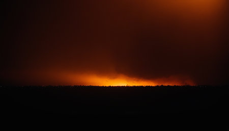 Fiery orange fire in the city at night. Stock photo for designの素材