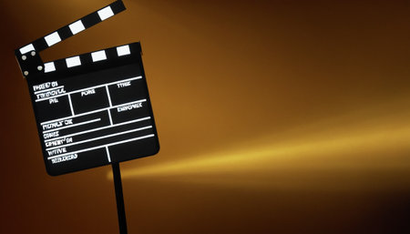 Movie clapper board on a golden background. 3D Renderingの素材