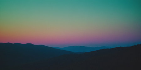 Sunset in the mountains. Blue sky with pink and purple colors.の素材