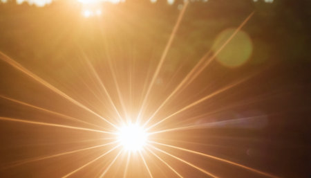 Sunset with lens flare. Abstract natural background with sunbeams.の素材