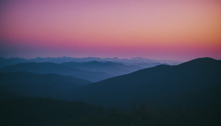 Beautiful sunset in the mountains. Blue and purple colors. Panoramic view.の素材