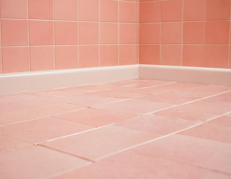 Pink tile floor in a bathroom with space for text or image.の素材