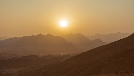 sunset over the mountains in egypt, photo as a background, digital imageの素材
