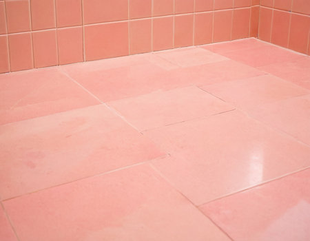 Ceramic tile floor with pink ceramic tiles in the bathroom.の素材