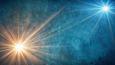 Sun burst with rays of light on blue textured wall background.の素材