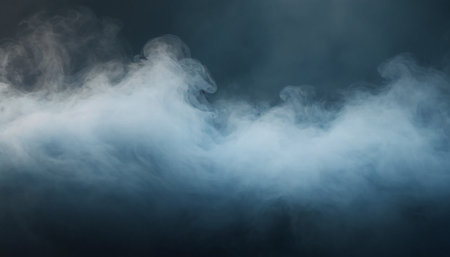 Dense clouds of white smoke on a dark background. Abstract backgroundの素材