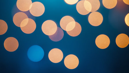 Abstract circular colorful bokeh from the party light on blue backgroundの素材
