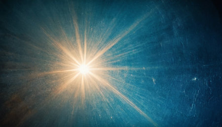 Sun burst with lens flare over grunge textured blue background.の素材