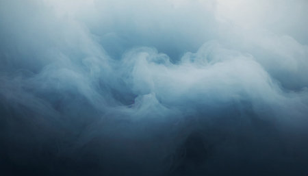 Blue cloud of smoke on a dark background. Abstract background for design.の素材