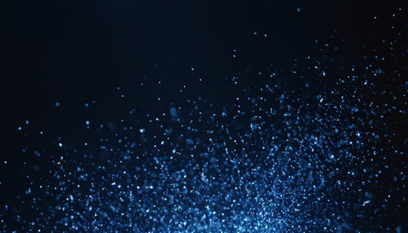 abstract blue glitter bokeh light defocused on black backgroundの素材