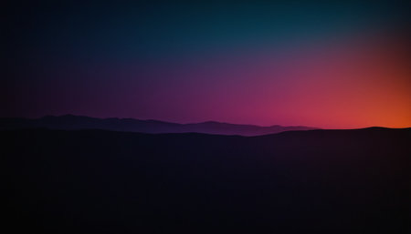 Silhouette of mountains at sunset. Colorful sky background.の素材