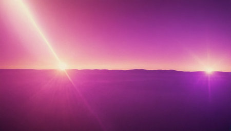 sunset in the mountains with sunbeams and lens flare effectの素材