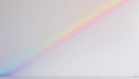 Rainbow on a white wall. Horizontal photo with copy spaceの素材