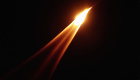closeup of a lit candle on a black background with copy spaceの素材