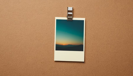 Top view of blank photo frame on wooden background. Mockup for designの素材