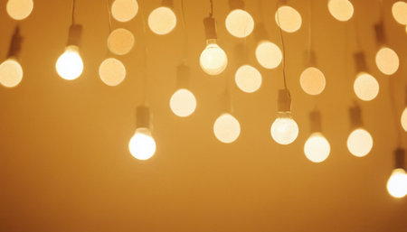 light bulbs on a yellow background with bokeh effect, vintage styleの素材