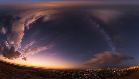 Aerial view of the night city and the Milky Way in the skyの素材