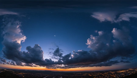 Night sky with clouds and stars. Panoramic view of the city.の素材