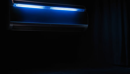 Air conditioner in dark room with blue light and black curtain.の素材